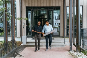 2 men walking outside